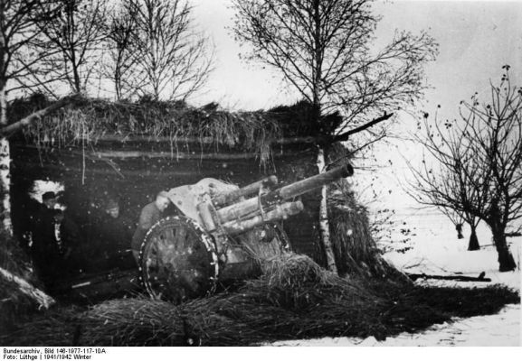 Click to view full size image
 ============== 
Soviet Union.- light field howitzer 18 (leFH 18) fires before its camouflaged position.

Source: German Federal Archive
