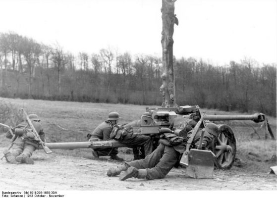 Click to view full size image
 ============== 
German 7.5 cm PaK 40 gun and crew in Northern France, Oct 1943; note Kar98k rifle.

Source: German Federal Archive
