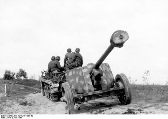 Click to view full size image
 ============== 
German 7.5 cm PaK 40 anti-tank gun being towed by SdKfz. 10 half-track vehicle, Vitebsk, Russia, Jun 1944.

Source: German Federal Archive
