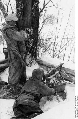Click to view full size image
 ============== 
German MG42 machine gun crew in Russia, Jan 1944; Sturmgewehr 44 assault rifle.

Source: German Federal Archive
