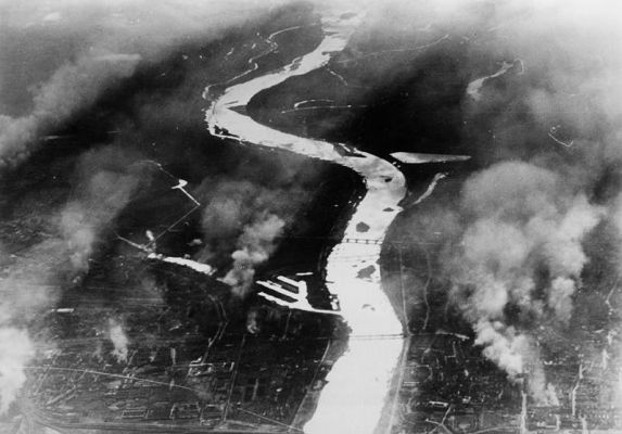 Click to view full size image
 ============== 
Warsaw, Poland.- view South from a German plane. View of the Vistula river and fires from bombing attacks. September 25 1939.
