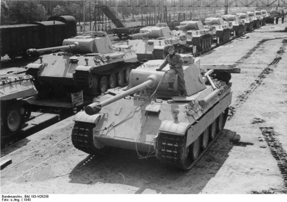 Click to view full size image
 ============== 
Panzer V Panther Ausf. D medium tanks on rail cars waiting to be shipped to the front, Apr-May 1943.

Source: German Federal Archive
