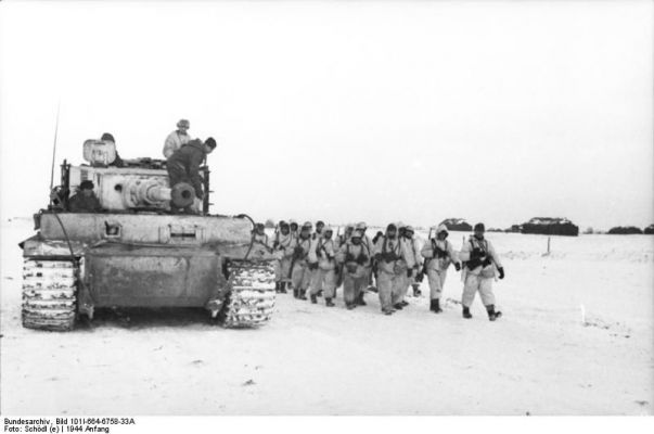 Click to view full size image
 ============== 
German soldiers and Tiger I heavy tank on a snowy road in Eastern Europe, Jan 1944.

Source: German Federal Archive
