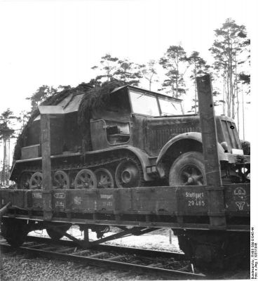 Click to view full size image
 ============== 
German SdKfz. 7 half-track vehicle on a rail car, Peenemünde, Germany, 1937.

Source: German Federal Archive
