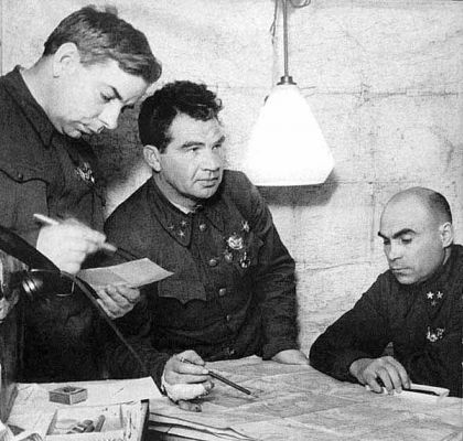 Click to view full size image
 ============== 
Stalingrad 1942-43 | 800 metres from the enemy; the head-quarters of the 62nd army. From left to right: Chief of staff N. I. Krilov, army commander V. I. Chuikov, member of the Military council, K. L. Gusrov.
