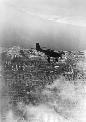 Click to view full size image
 ============== 
Ju 87 Stuka dive bomber over Stalingrad, Russia, Oct 1942, photo 2 of 3.

Source: German Federal Archive
